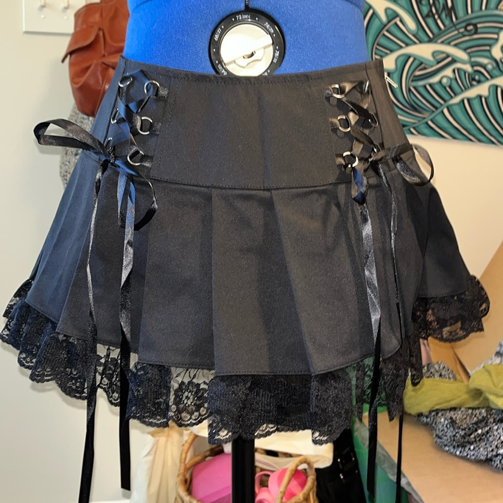 Dolls kill black nylon, lace, pleated mini skirt. Corset front. Size small.